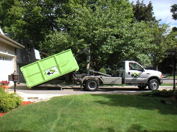 A bin there dump that truck setting down a bin